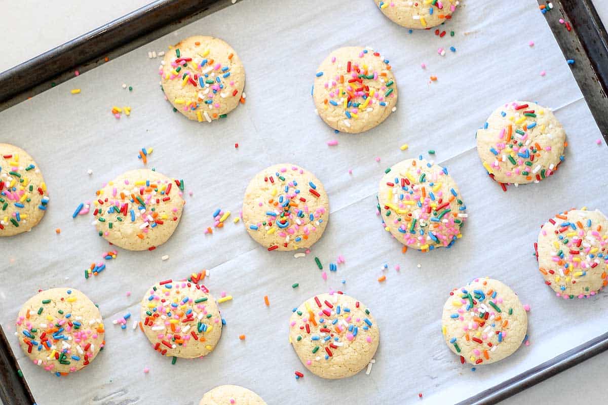 3-ingredient cake mix cookies with sprinkles on baking tray