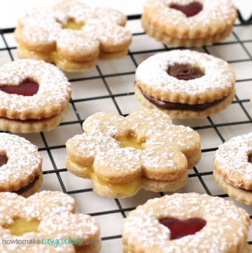linzer cookies filled with lemon curd, chocolate spread, and raspberry jam