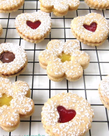 Linzer cookies filled with lemon curd, raspberry preserves, and Nutella.