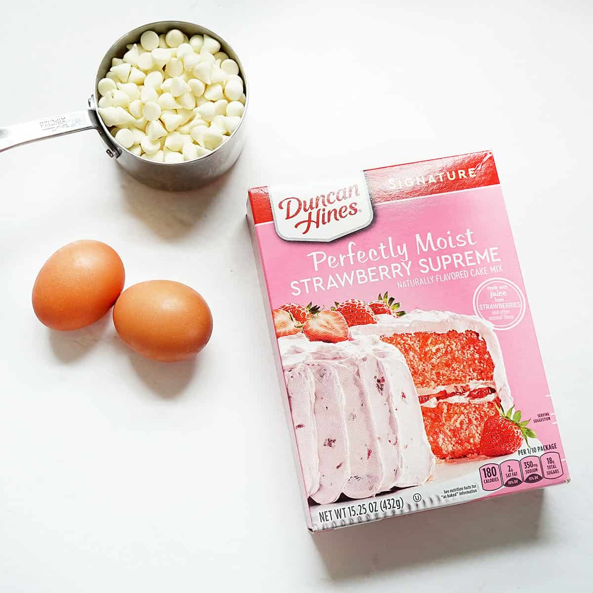 preparing strawberry cake mix cookies with white chocolate chips
