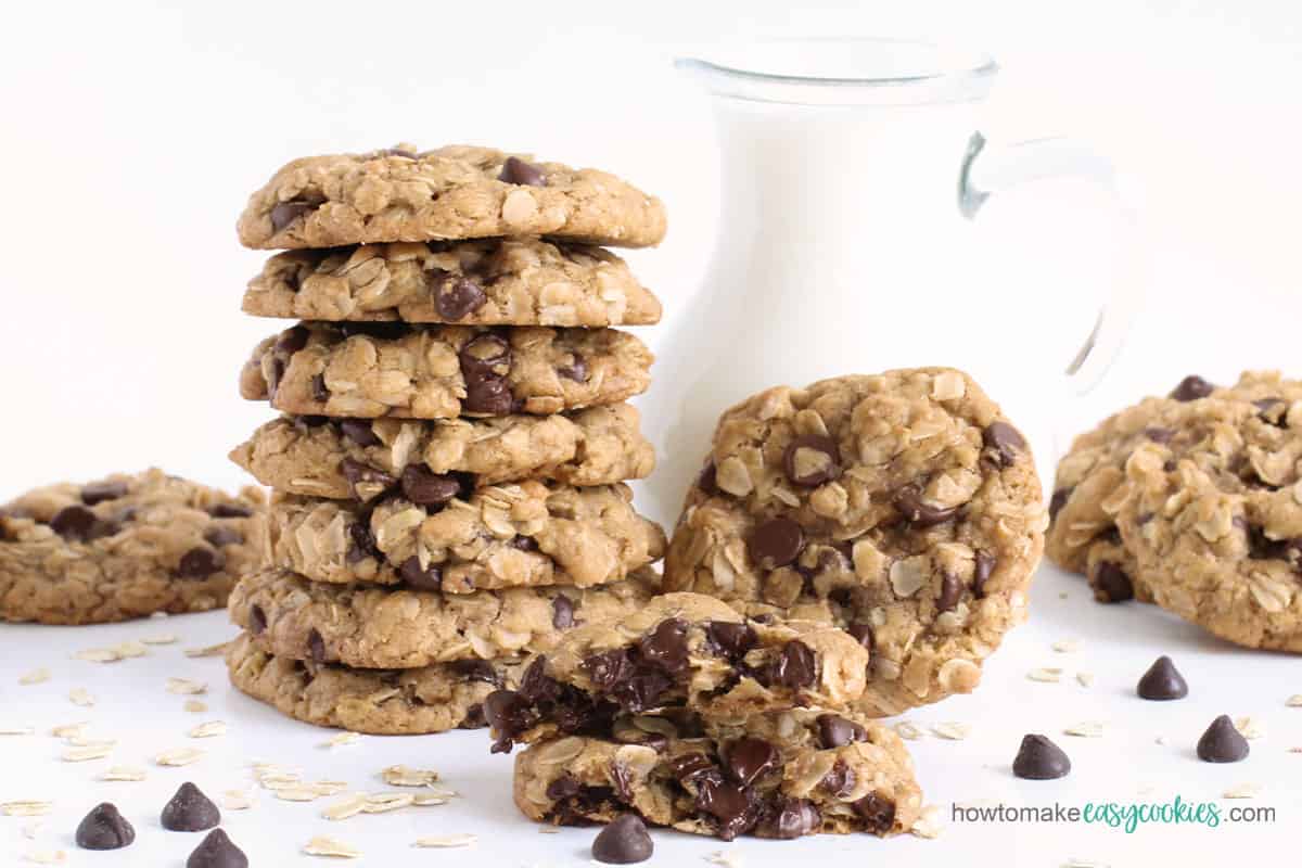 homemade oatmeal chocolate chip cookies with a pitcher of milk