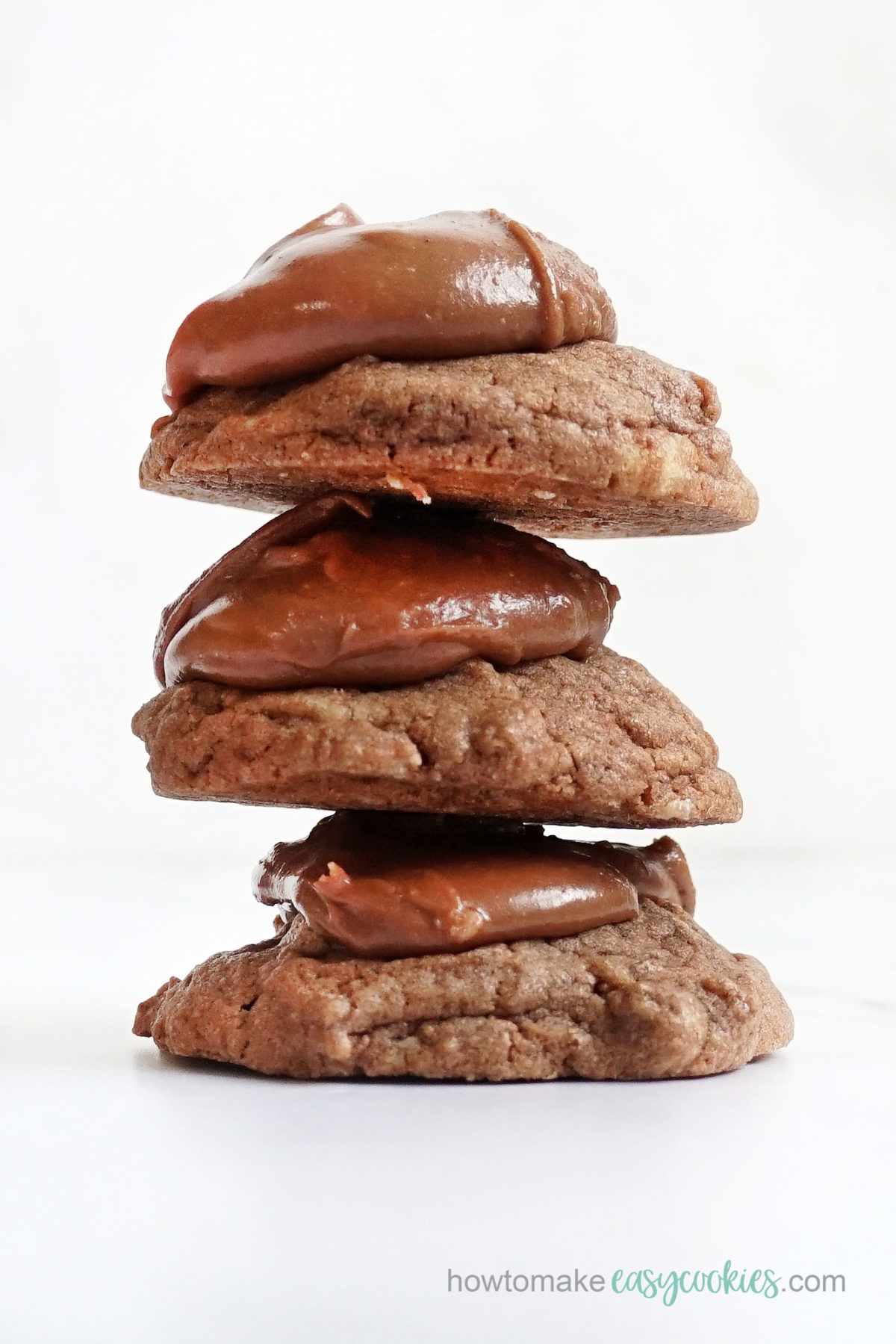 stack of Texas sheet cake cookies with chocolate frosting 