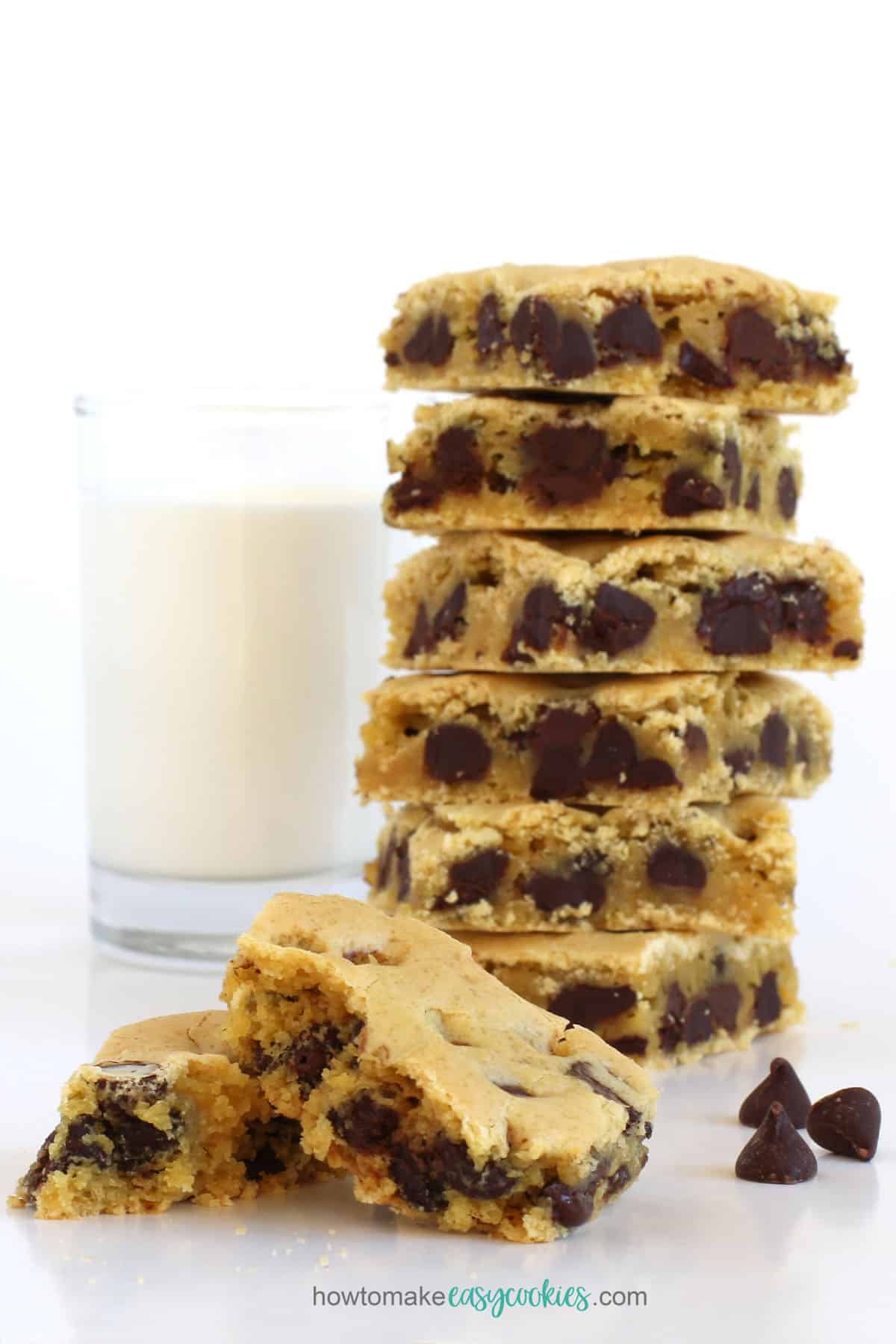tall stack of soft and chewy chocolate chip cake mix cookies served with a glass of cold milk