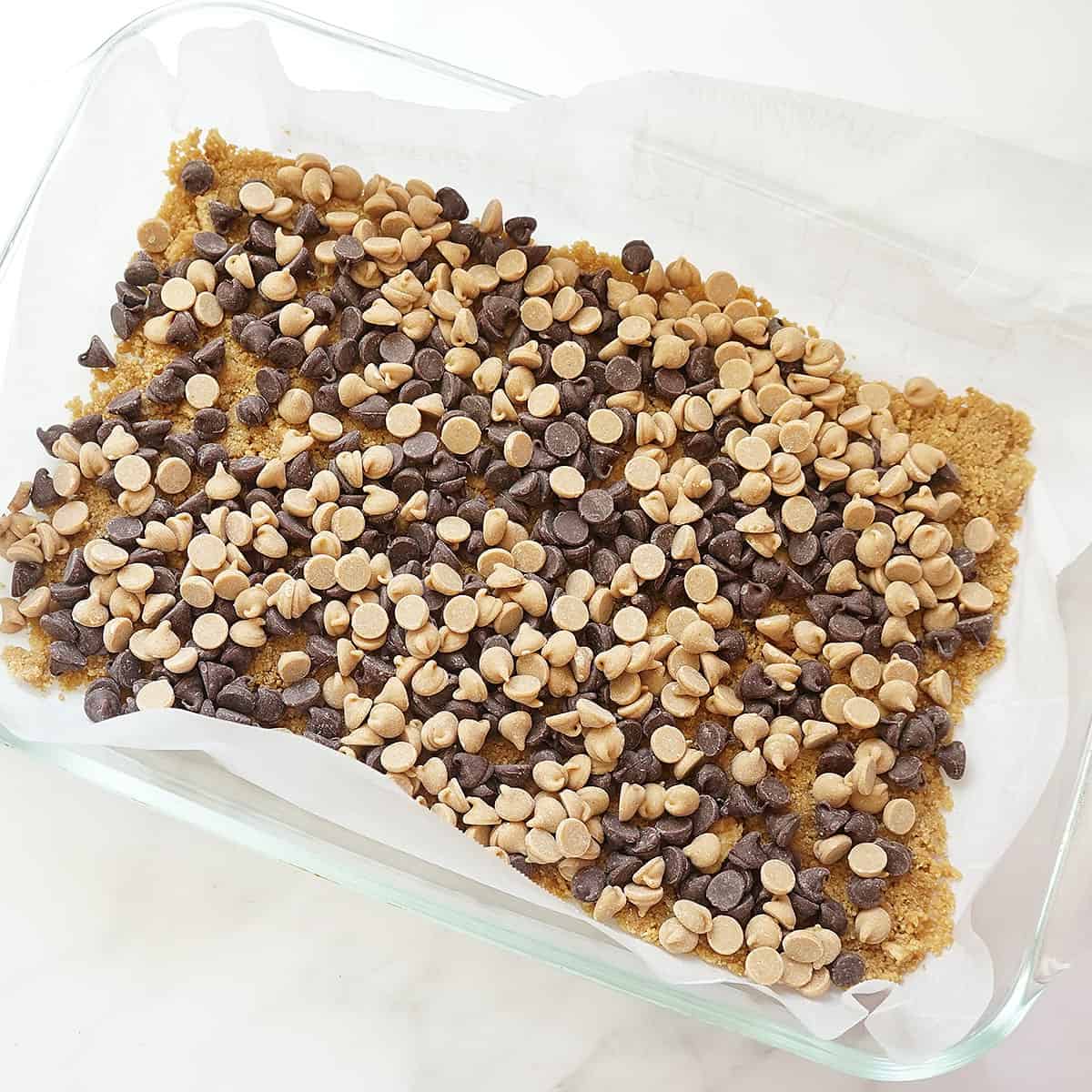 chocolate chips and peanut butter chips for seven layer bars