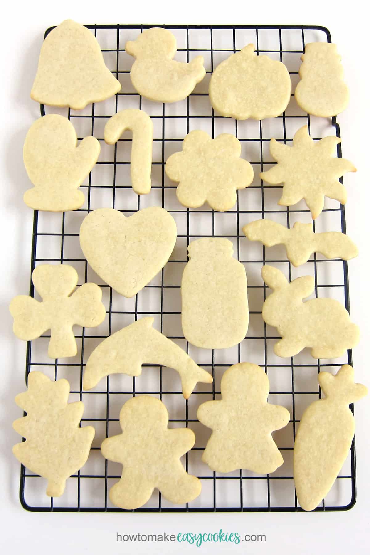 cream cheese sugar cookie cut-outs on cooling rack