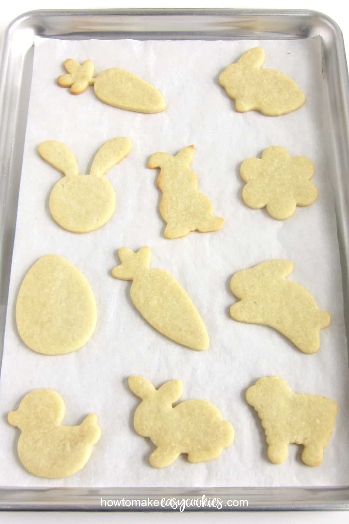 cut-out Easter sugar cookies on baking sheet