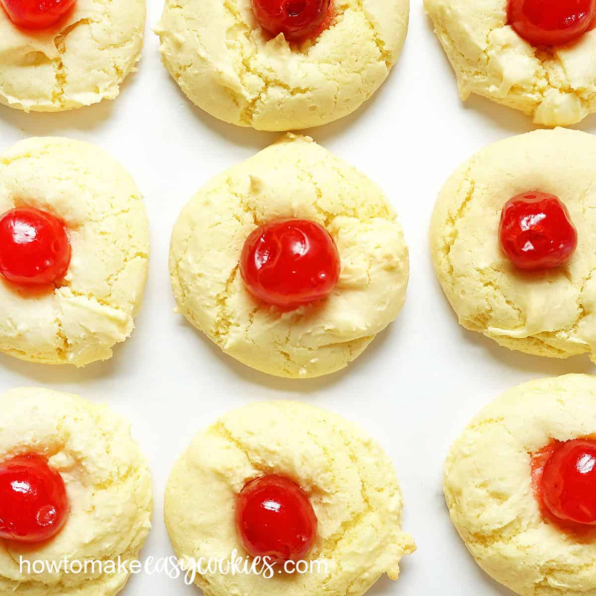 close-up of pineapple cake mix cookies with maraschino cherries
