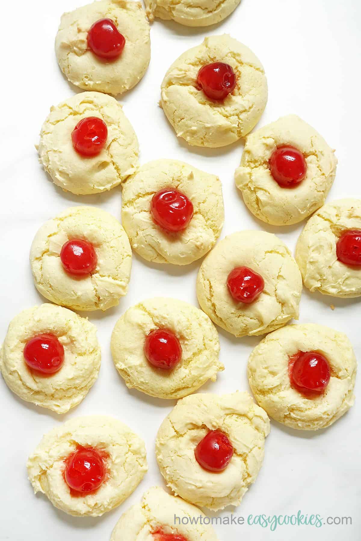spread of pineapple cake mix cookies with cherries