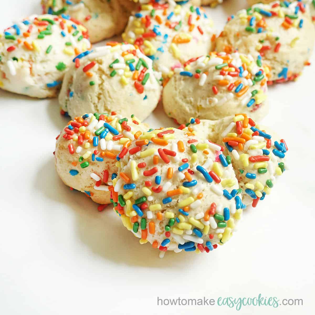 close up of stacked Funfetti cake mix cookies with rainbow sprinkles