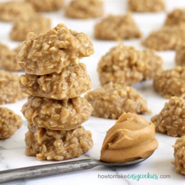no bake peanut butter oatmeal cookies set in front of a spoonful of creamy peanut butter