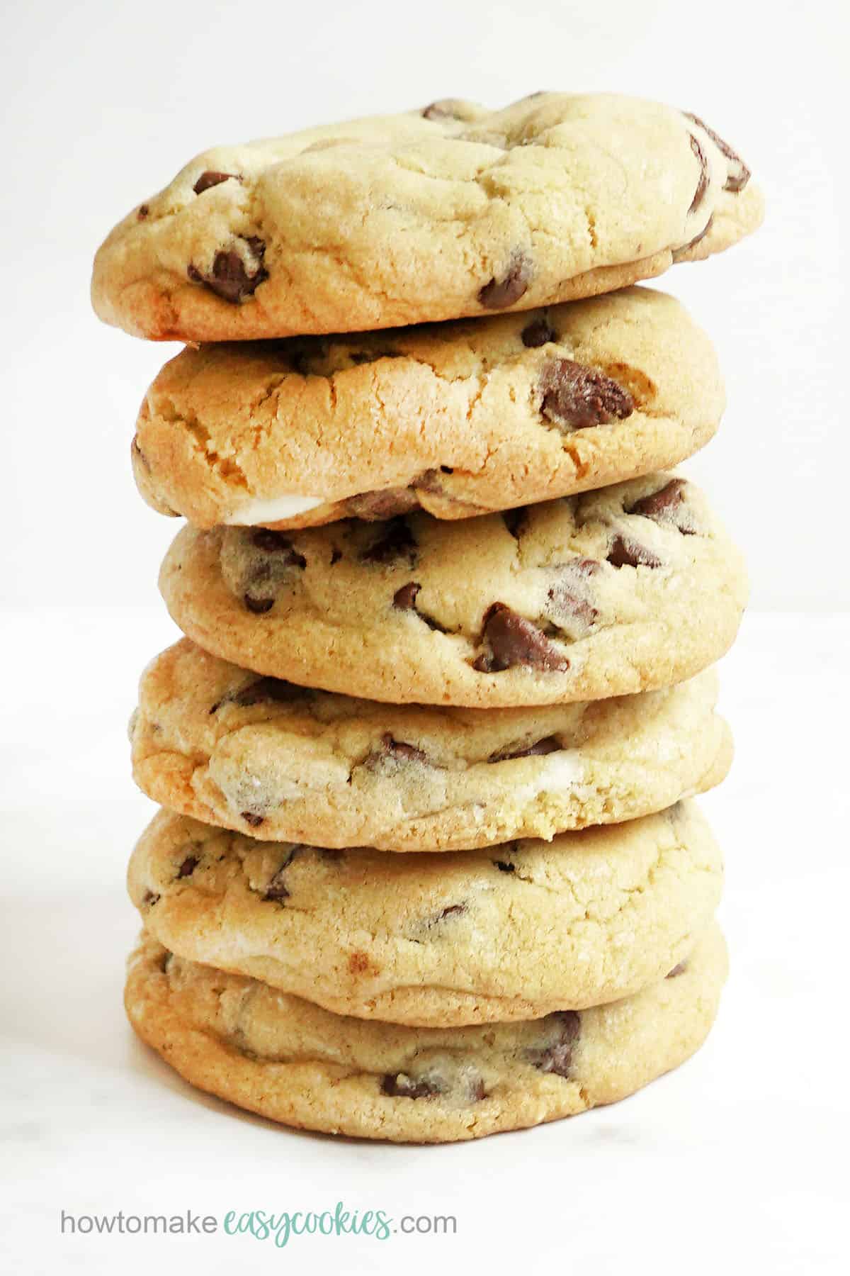 stack of chocolate chip cookies stuffed with cream cheese