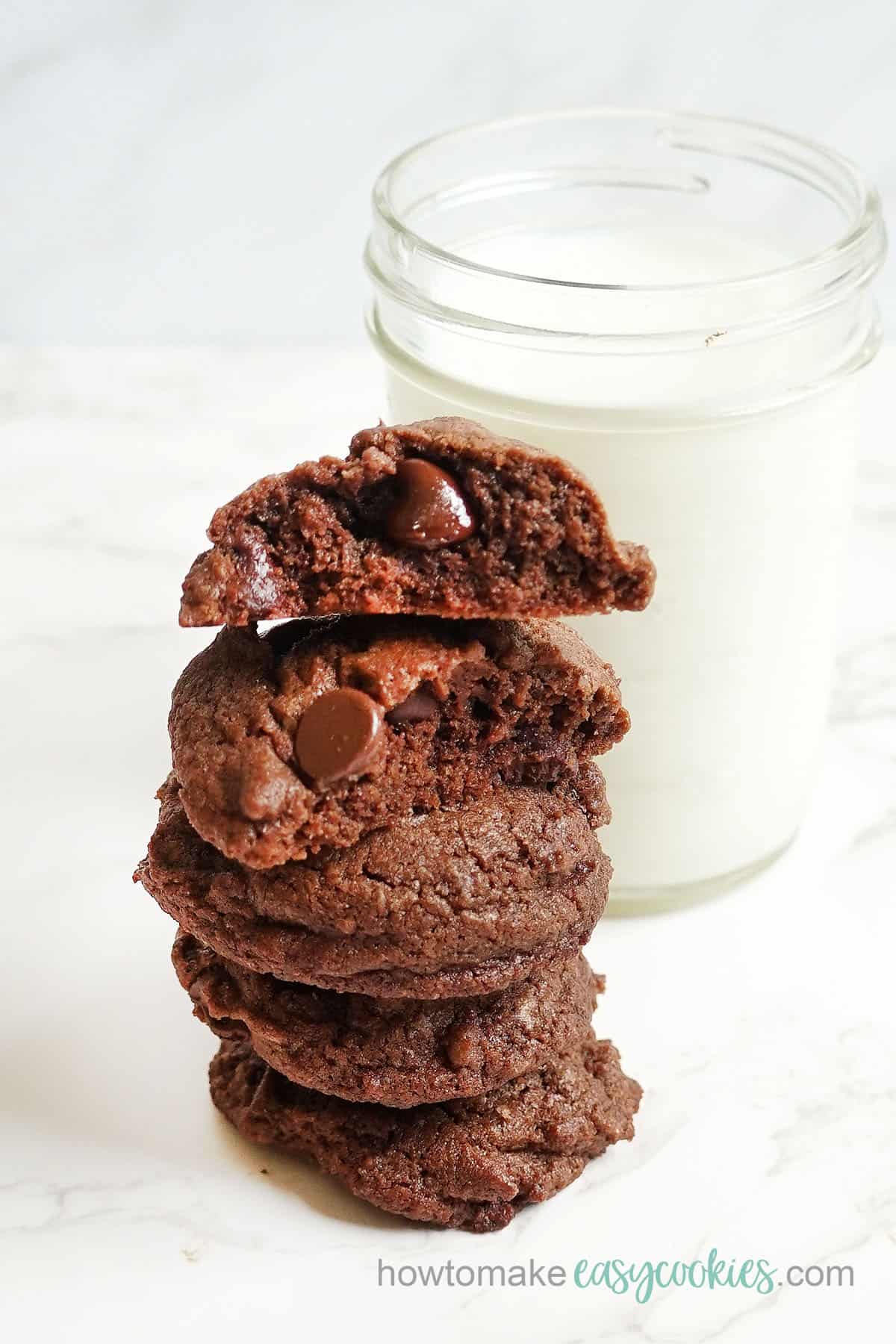 fudgy  brownie cookies  with a glass of milk 