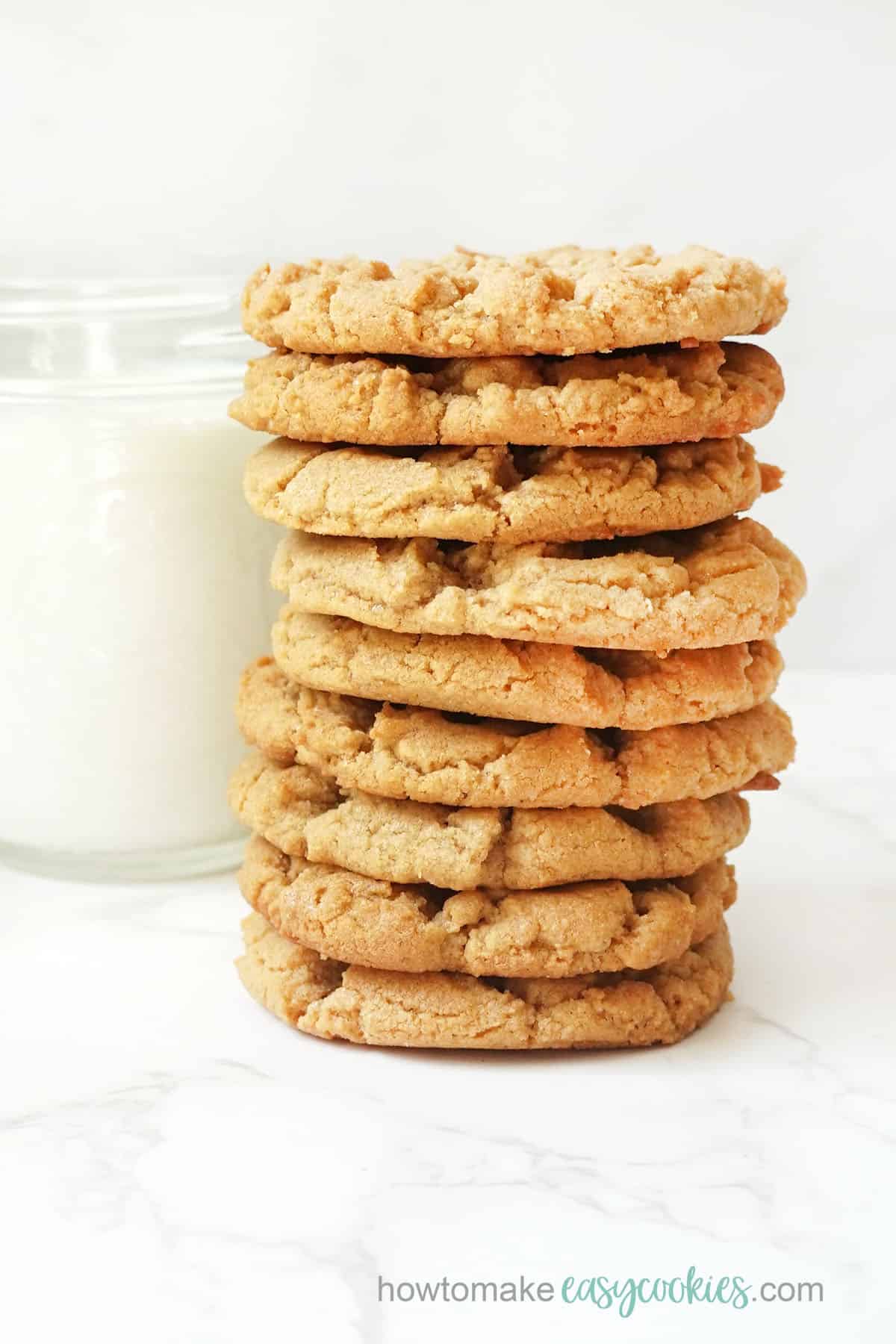 stack of gluten free peanut butter cookies with glass of milk