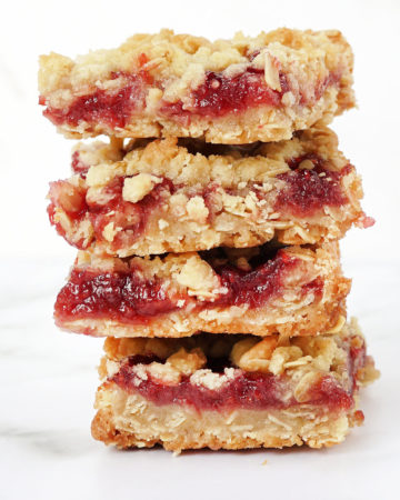stack of cookie bars, raspberry crumbles with oatmeal topping