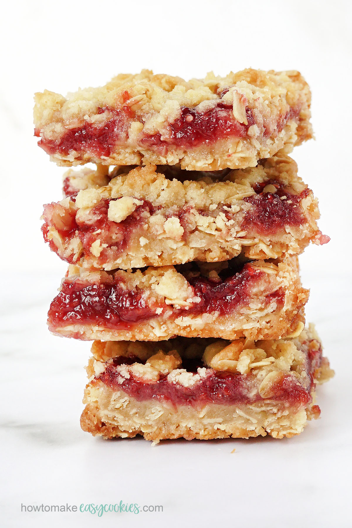 stack of cookie bars, raspberry crumbles with oatmeal topping 