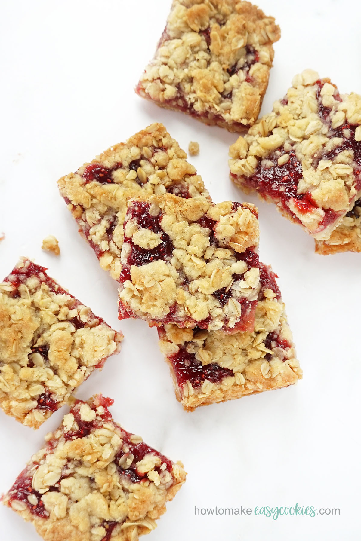 raspberry oatmeal bars with crumble topping and crust