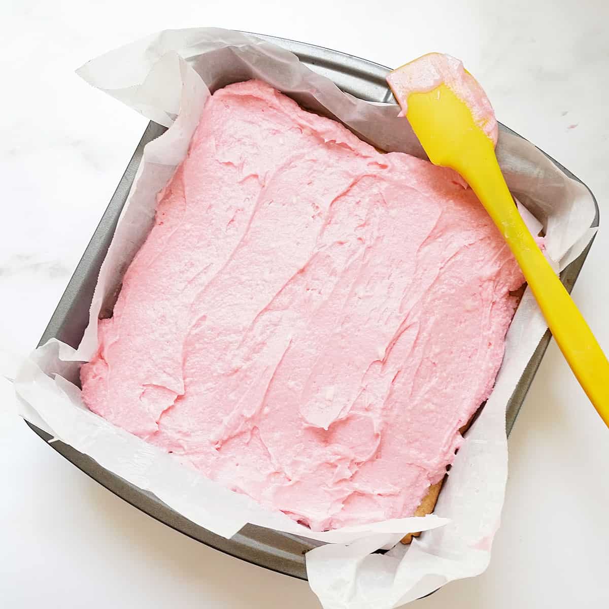 sugar cookie bars with pink frosting