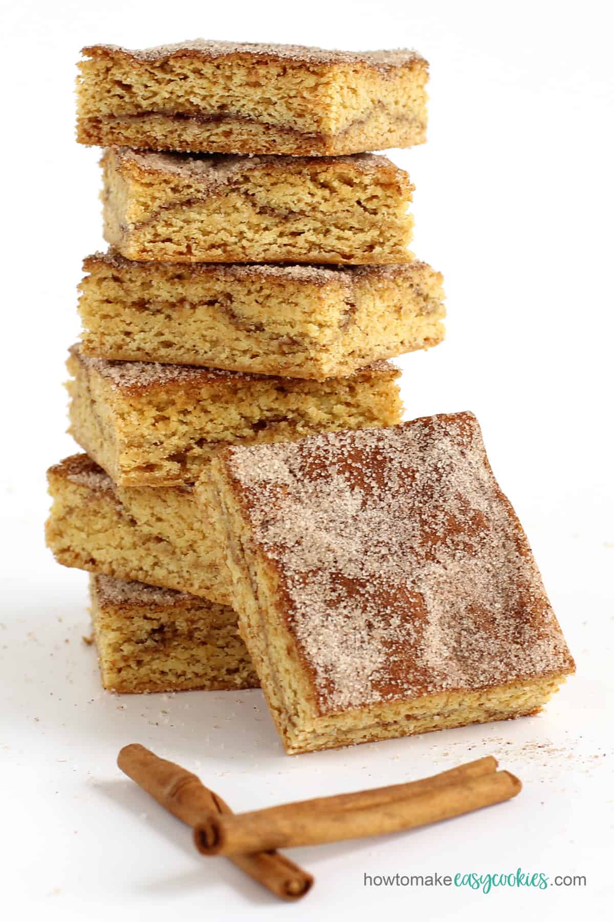 snickerdoodle cake mix cookie bars topped with cinnamon sugar