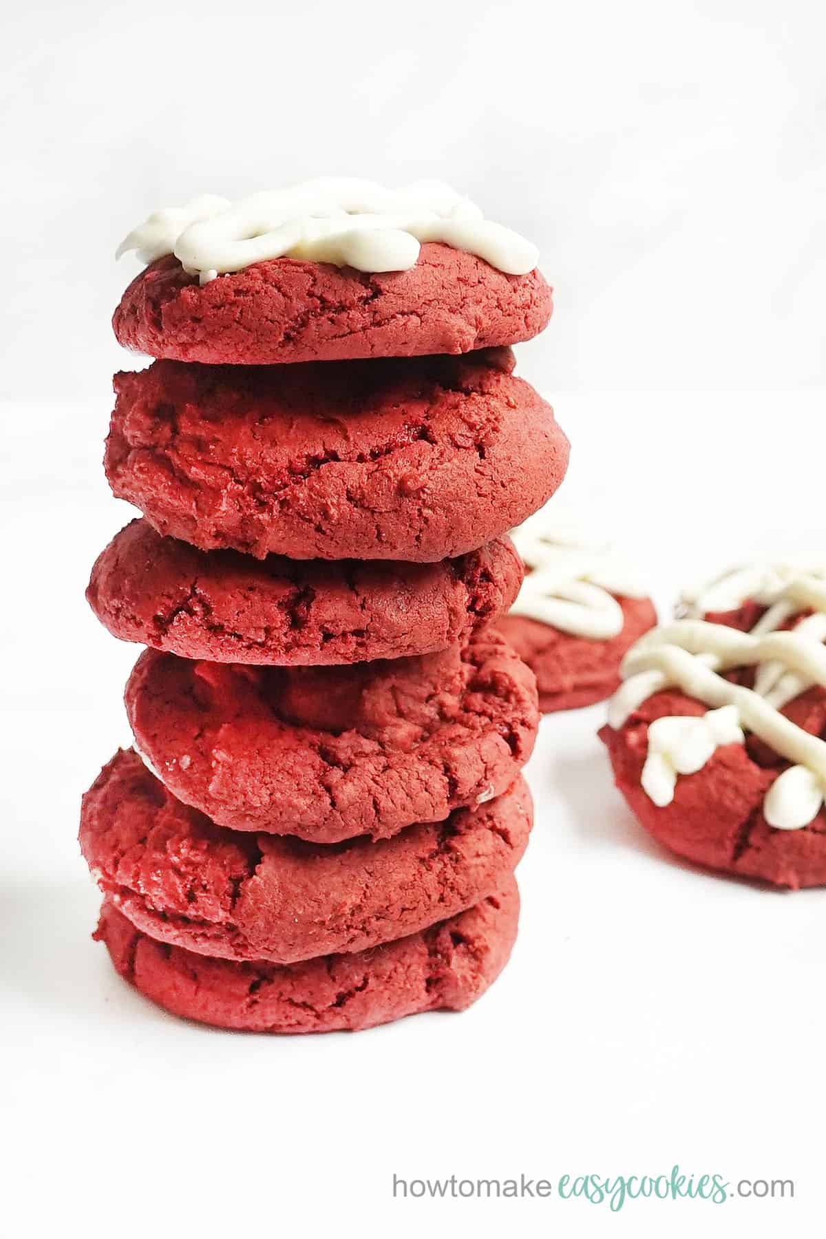 stack of red velvet cookies from cake mix with cream cheese frosting