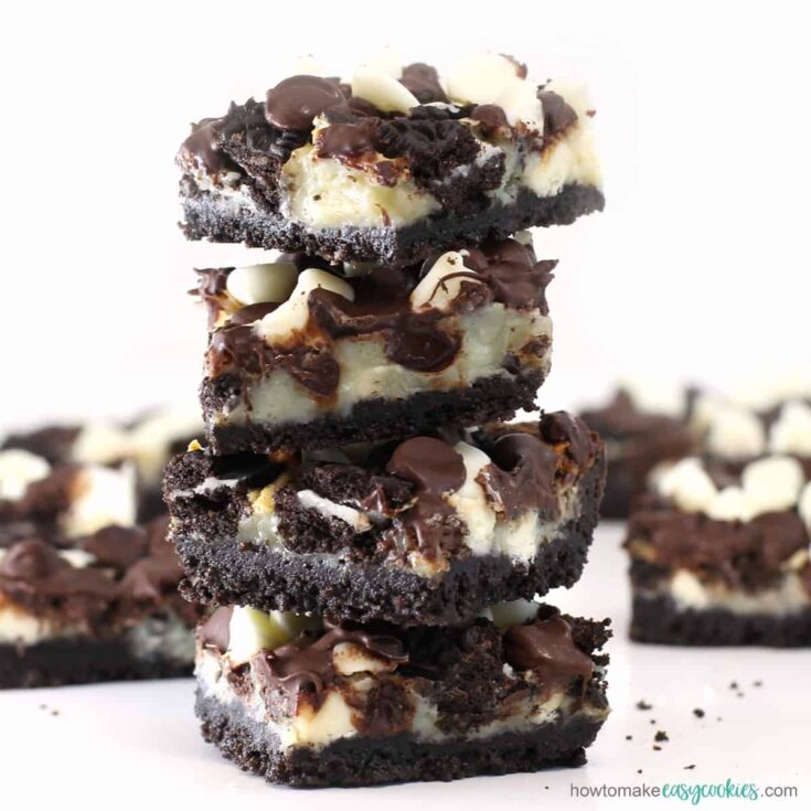 cookies and cream Oreo magic bars topped with white chocolate and semi-sweet chocolate chips