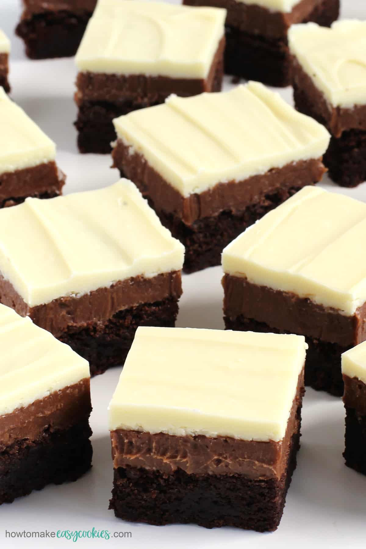 milk, dark, and white triple chocolate cookie bars (brownies)