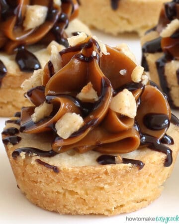 shortbread cookie cup topped with caramel, chocolate, and toffee bits