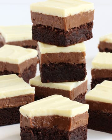white, milk, and dark chocolate cookie bars stacked up showing the three layers