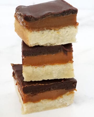 stack of millionaire's shortbread Twix cookies with caramel and chocolate ganache