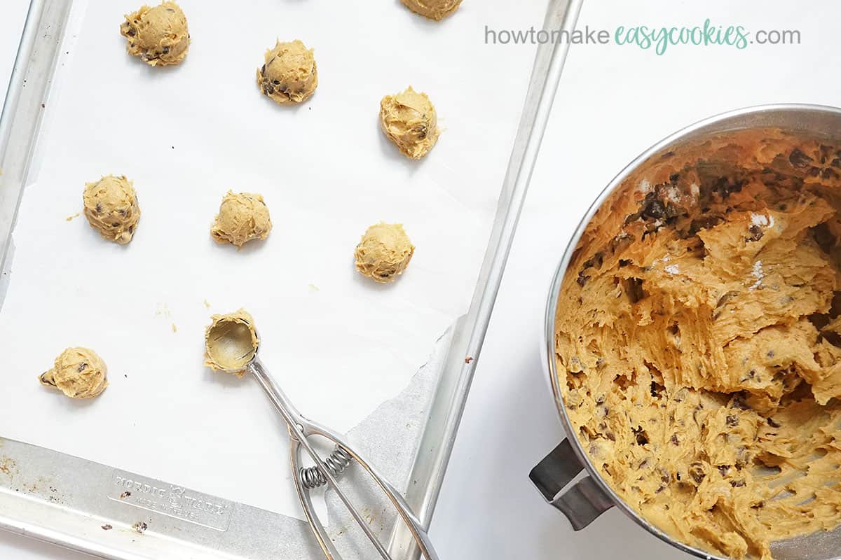 using cookie scoop for pumpkin chocolate chip cookies dough