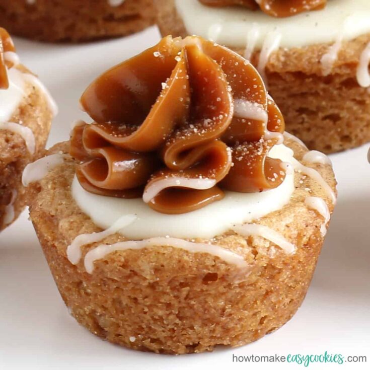 a Snickerdoodle cookie cup topped with a swirl of dulce de leche caramel and white chocolate ganache