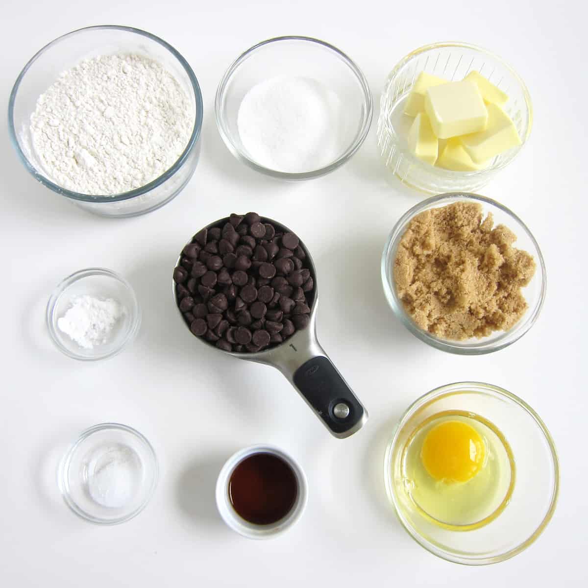 chocolate chip cookie dough ingredients: flour, sugar, butter, baking soda, chocolate chips, brown sugar, salt, vanilla, egg