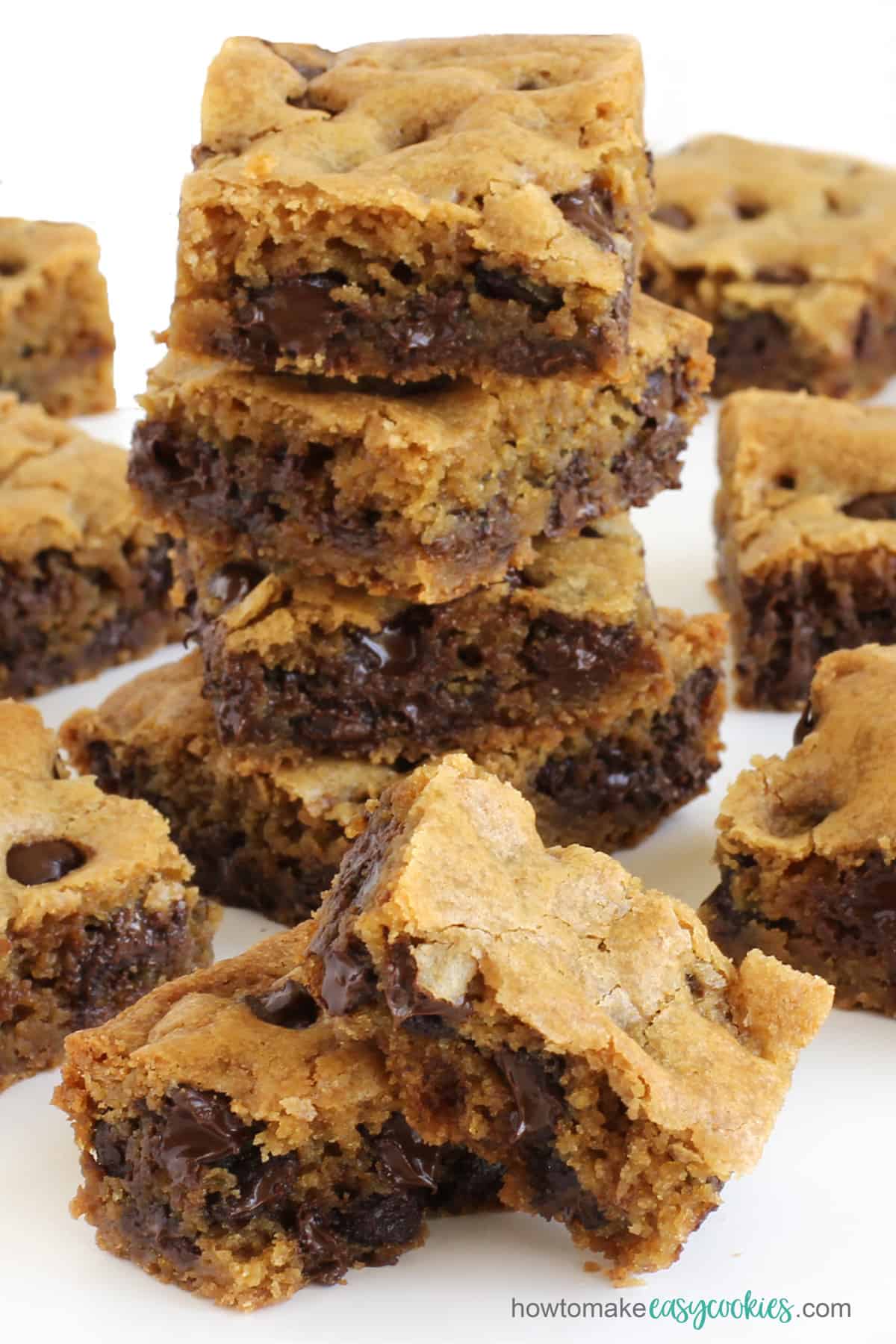 warm chocolate chip cookie bars right out of the oven have gooey melted chips inside