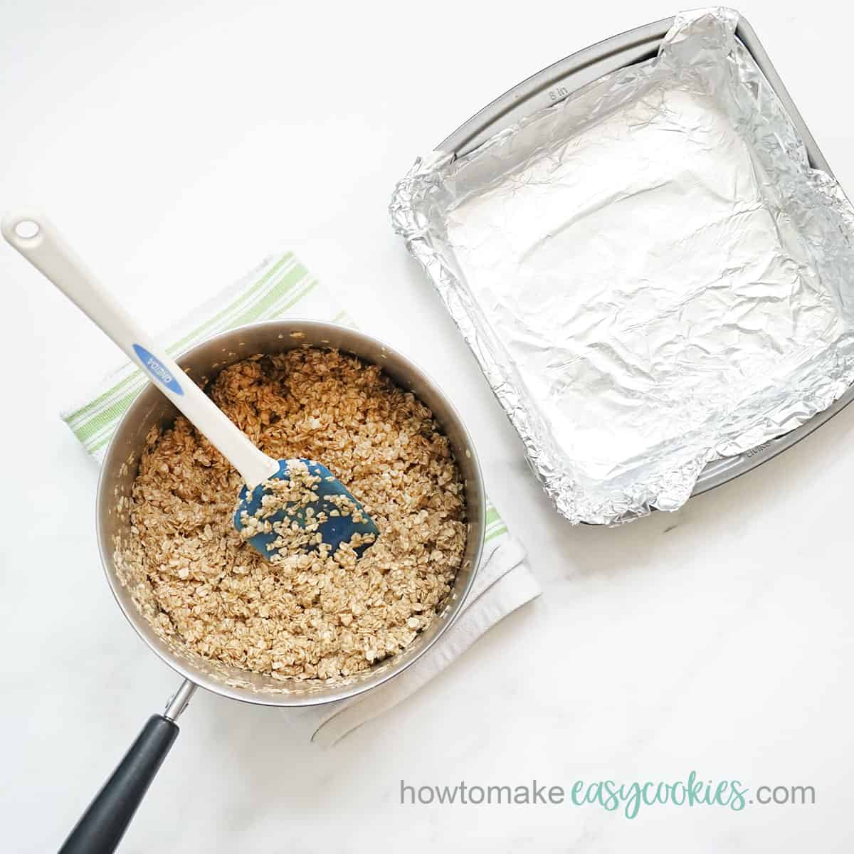 pouring butter oatmeal mixture into baking pan
