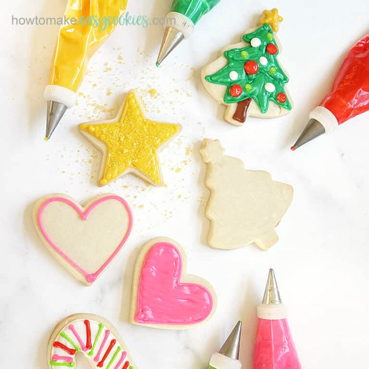 cut-out sugar cookies with powdered sugar and decorate with royal icing