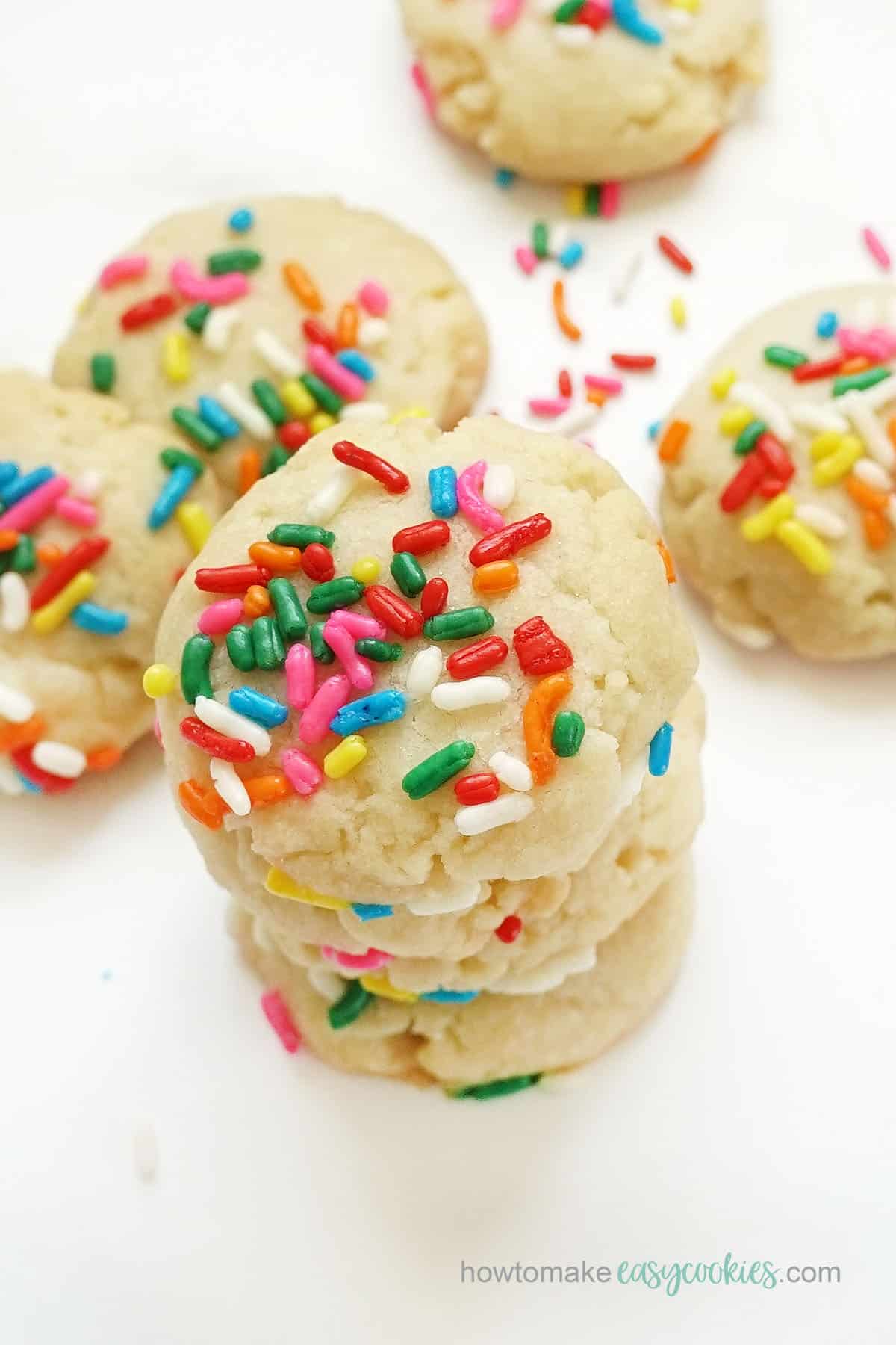 stack of sugar cookies with rainbow sprinkles