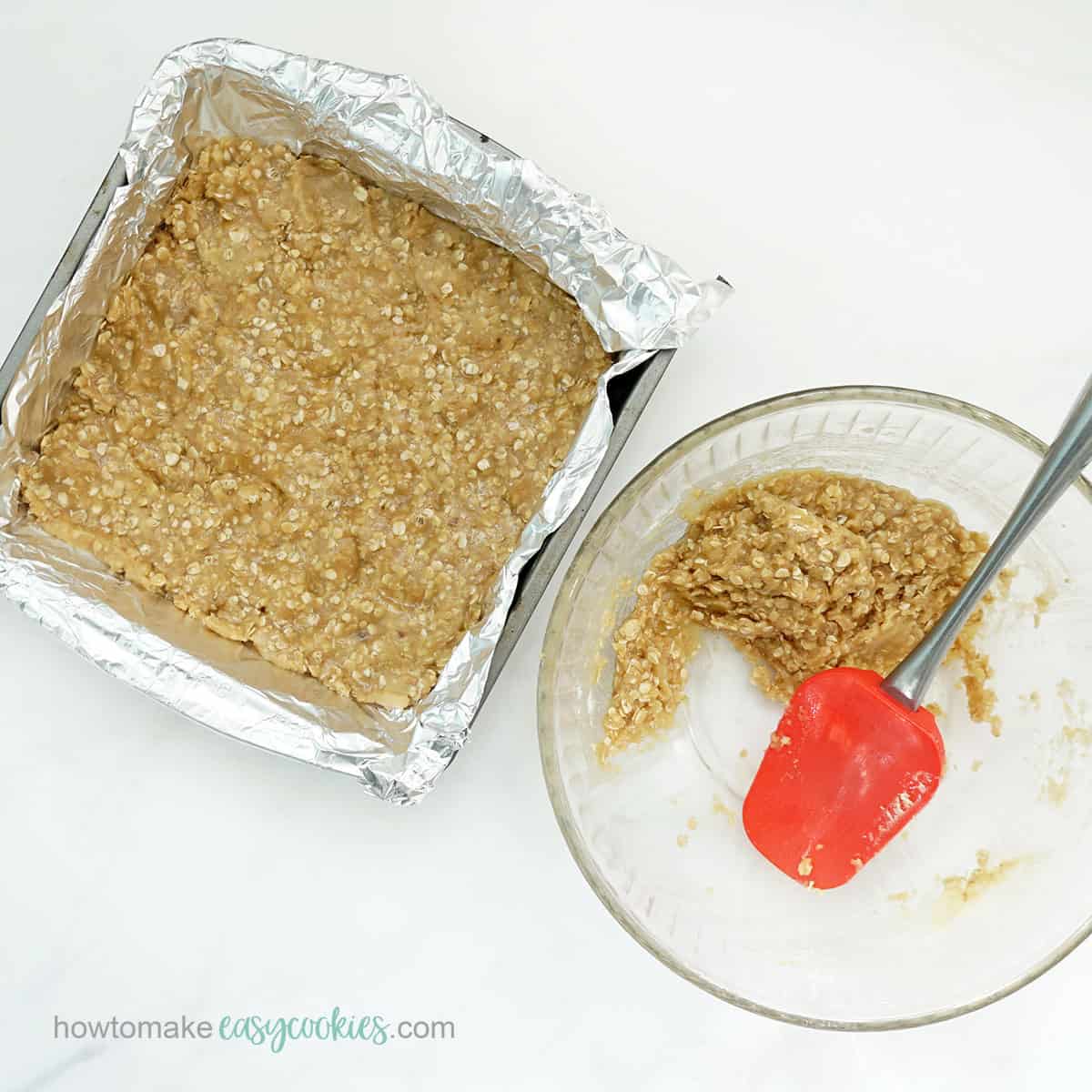 patting butter, brown sugar and oatmeal crust into square baking pan