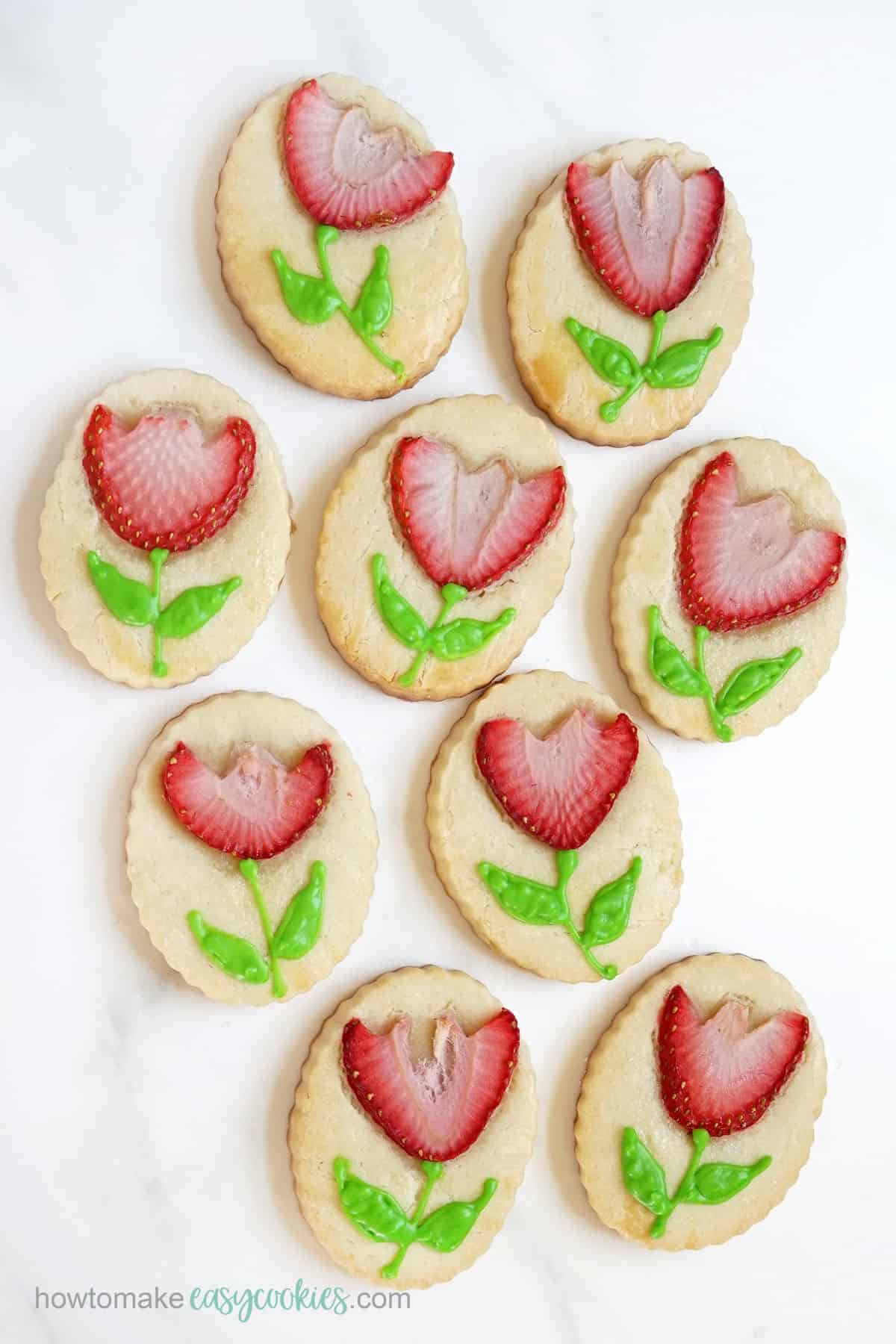 fresh strawberry flower cookies with piped icing 