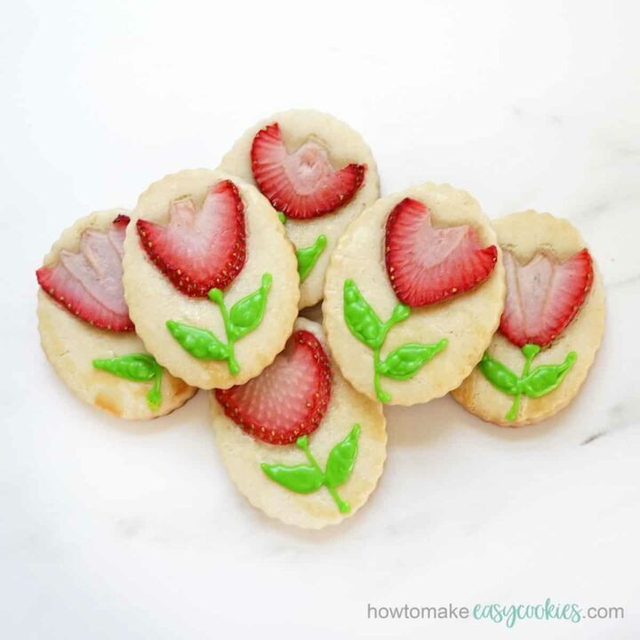 shortbread cookies with fresh strawberry "flowers" and piped icing