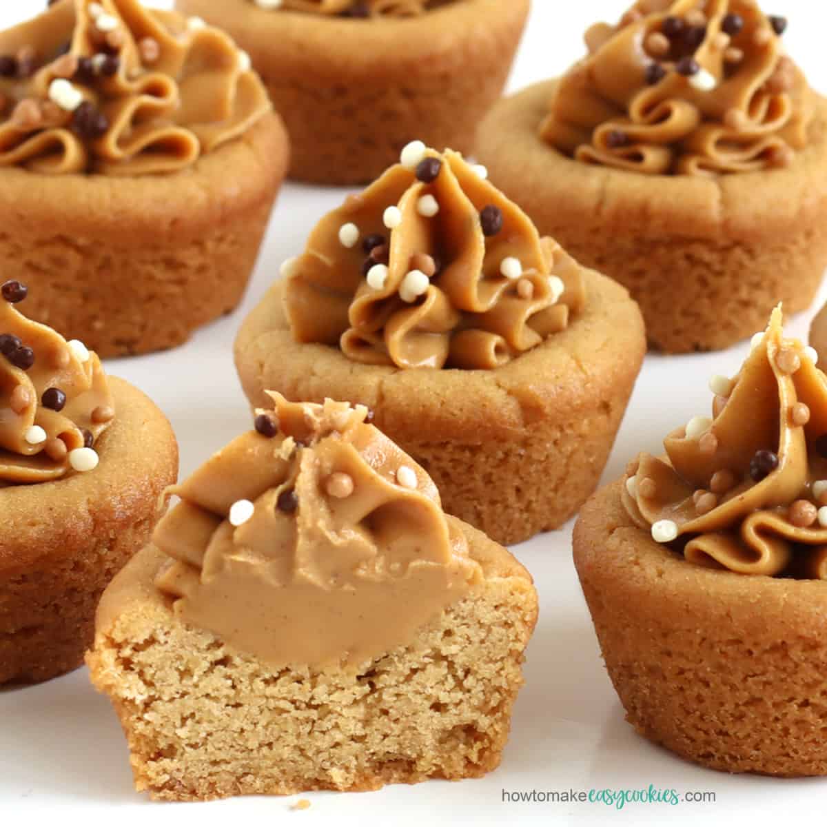 peanut butter cookie cups topped with a swirl of creamy peanut butter and chocolate Crispearls.