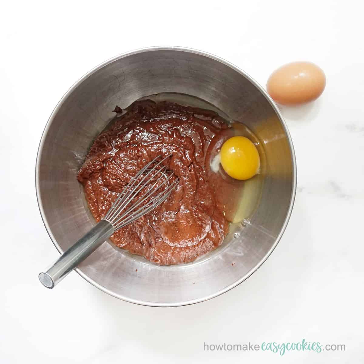 beating eggs into brownie batter